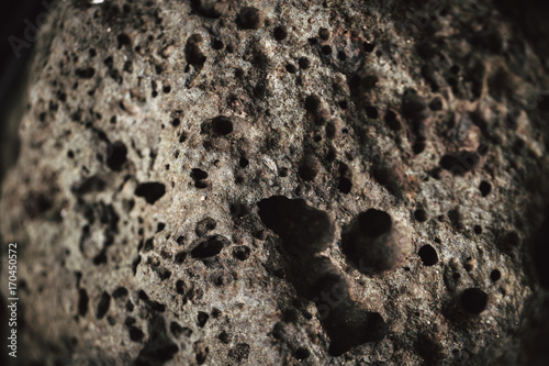 Closeup skin detail of Scoriaceous basalt Stone or Pumice and Scoria Rock from Volcano Lava look like meteorite.