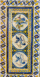 Strip of beautiful and colorful Portuguese tiles (azulejos) with drawings of birds and plants in Lisbon, Portugal