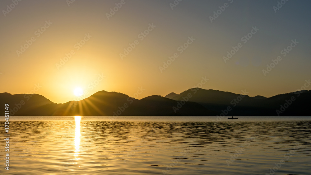 Beautiful sunrise over lake with mountains range. Beautiful sunrise over lake with mountains range.
