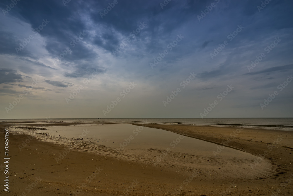 beach when sea dry and rainy cloud sky