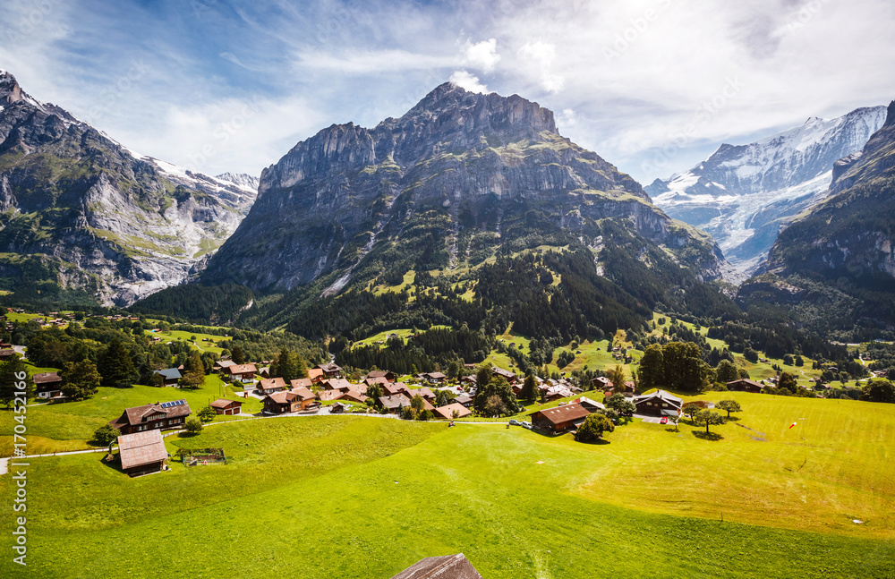Impressive view of alpine Eiger village. Popular tourist attraction. Location place Swiss alps, Grindelwald valley, Europe.
