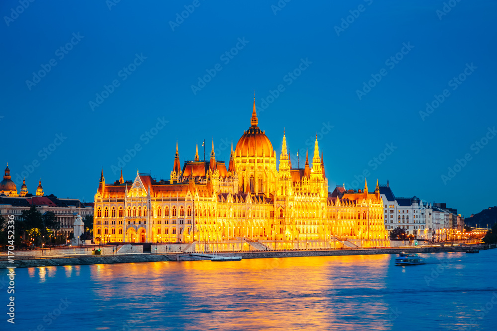 Evening view of Hungarian Parliament with Margit bridge. Famous place Budapest, Hungary, Europe.