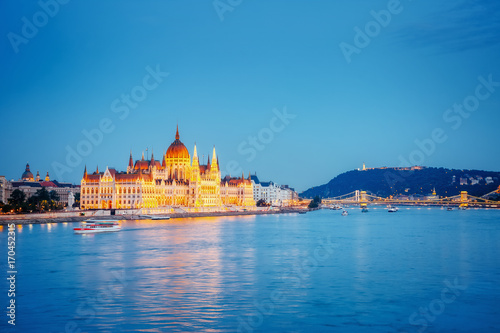 Evening view of Hungarian Parliament with Margit bridge. Famous place Budapest, Hungary, Europe. © Leonid Tit