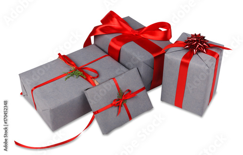 Christmas gift boxes in gray paper isolated on white
