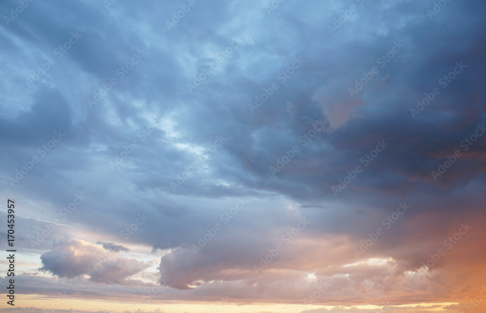 Stormy clouds in the sunset background 