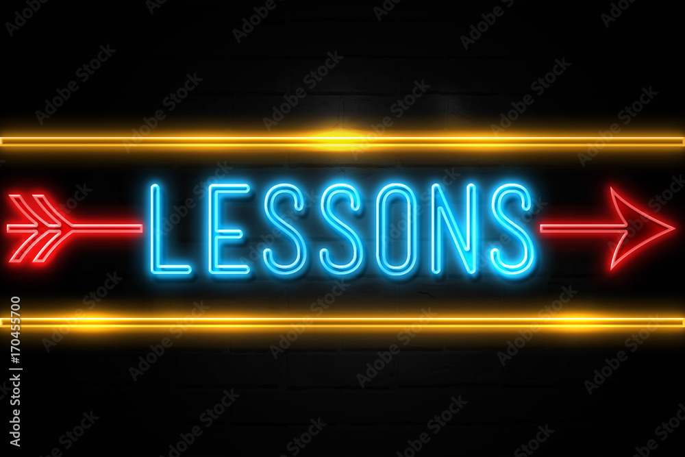Lessons  - fluorescent Neon Sign on brickwall Front view