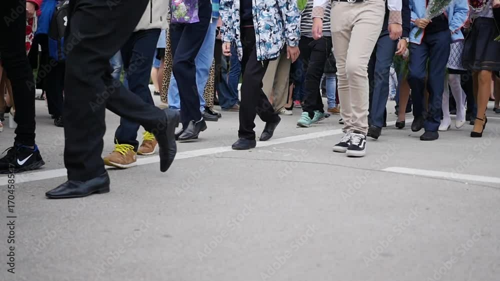Crowd of people walking on city street. Feet closeup Crowd of people walking on city street. Feet closeup