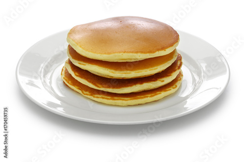  a stack of pancakes on a white dish isolated on white background