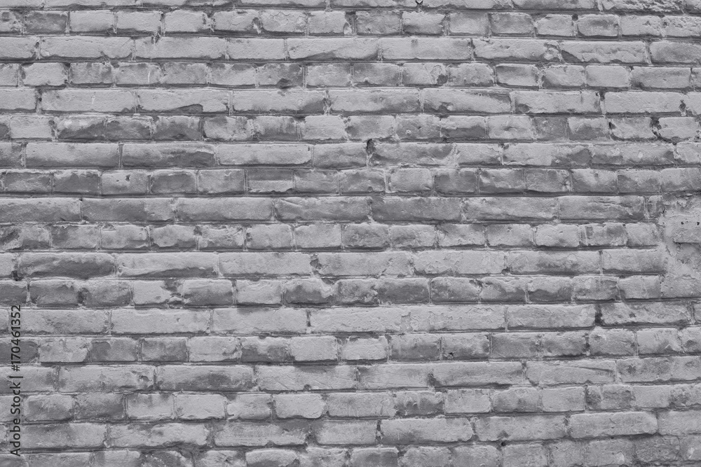 brick wall covered with neutral gray lime