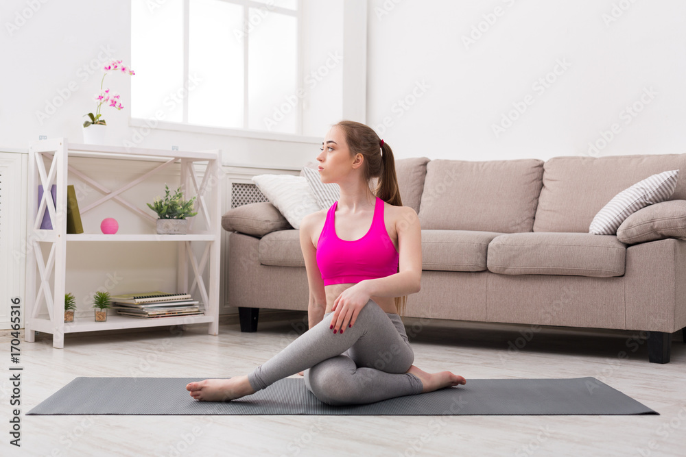 Woman training yoga in twisting sage pose. Woman training yoga in twisting sage pose.
