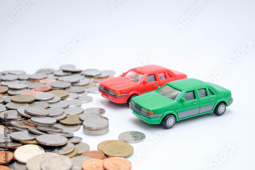 save money for investment concept Toy car and stack of coins