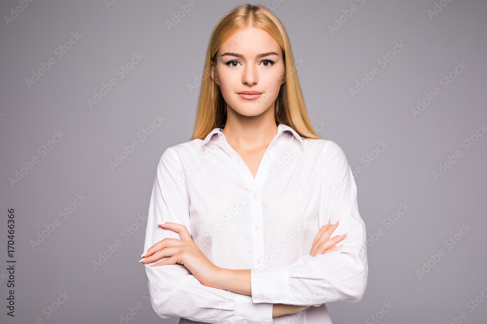 Portrait of beautiful business woman standing with hands folded and looking at camera over white background Portrait of beautiful business woman standing with hands folded and looking at camera over white background
