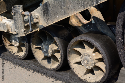 Close up of road grading machine wheels at construction site for new shopping center © merrimonc