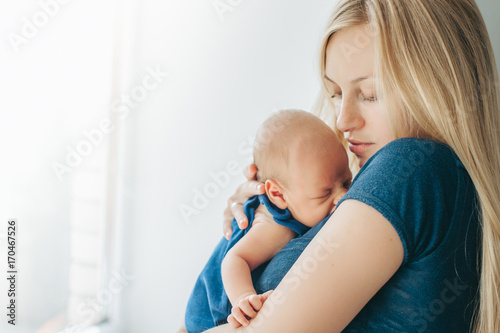 Newborn baby in mom's arms