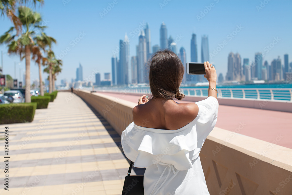 Tourist woman taking travel picture with phone Tourist woman taking travel picture with phone