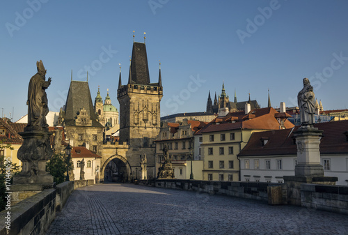 Early morning at Charles Bridge in Prague. In distance is Saint Vitius Cathedral