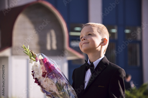 boy in a suit with flowers
