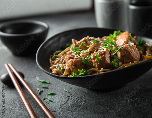 teriyaki salmon and soba noodle served with sesame seeds and chives
