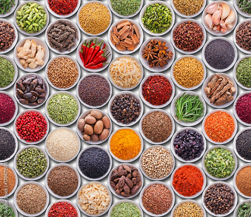 Bright colorful seamless texture with spices and herbs over whit