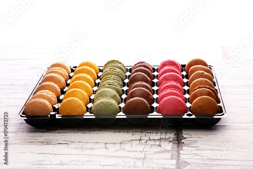 Sweet and colourful french macaroons or macaron on white background  Dessert.