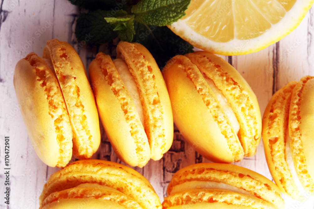 Sweet and colourful french macaroons or macaron with lemon Sweet and colourful french macaroons or macaron with lemon