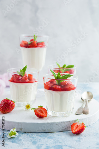 vanilla cream cheese and strawberry dessert on glasses