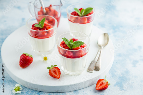 vanilla cream cheese and strawberry dessert on glasses