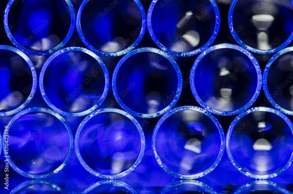 Abstract: Wall of Blurred Blue Circles Forming Systematical Pattern Abstract: Wall of Blurred Blue Circles Forming Systematical Pattern