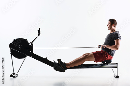 Man Using A Press Machine In A Fitness Club.