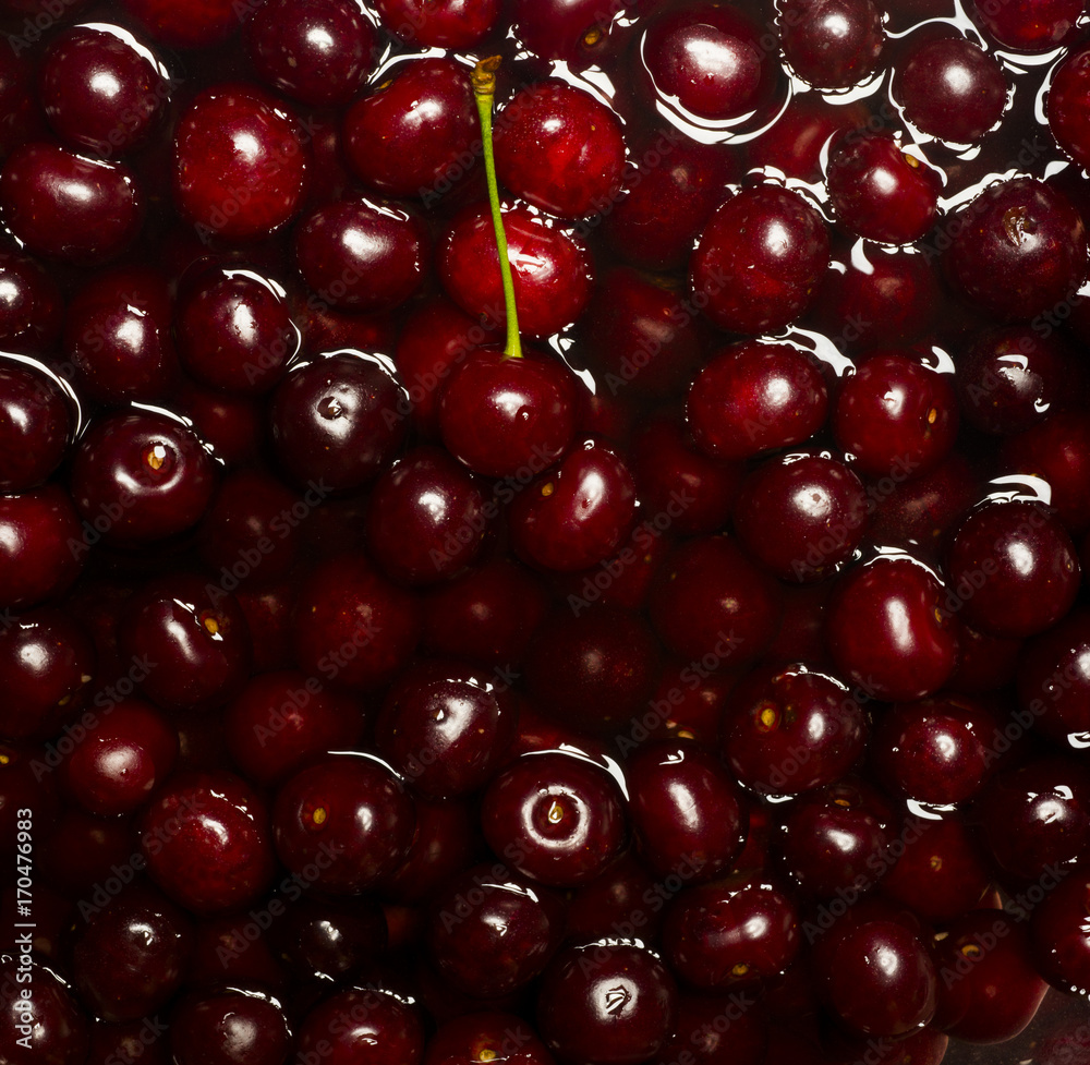 Ripe fresh rich cherries in water. Fruit background. Ripe fresh rich cherries in water. Fruit background.