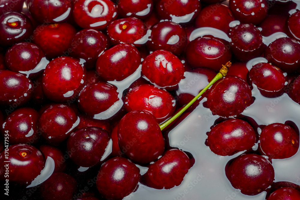 Ripe fresh rich cherries in water. Fruit background. Ripe fresh rich cherries in water. Fruit background.