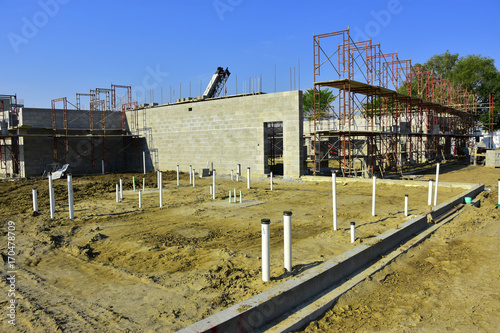 Commercial concrete block building under construction.