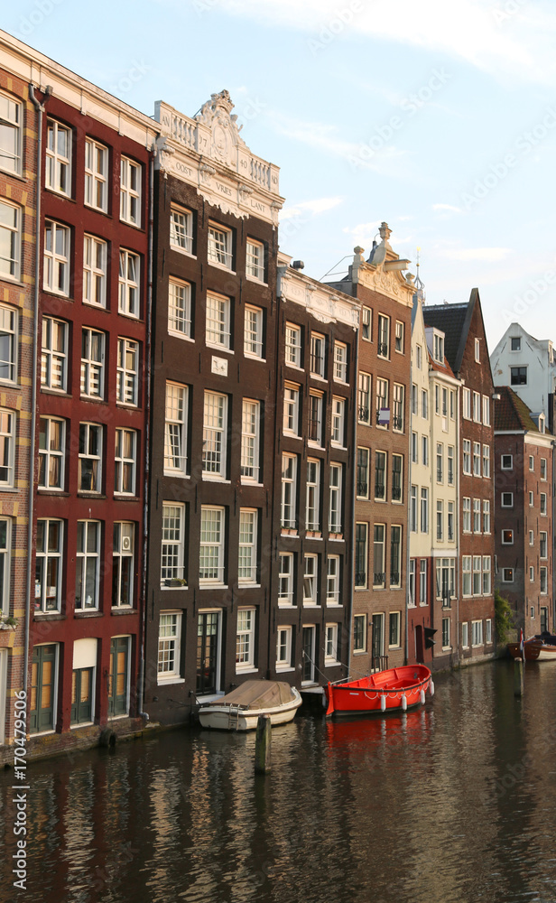 houses with Dutch-style architecture on the Canal of  Amsterdam