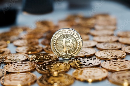 Bitcoin coin on gold coins