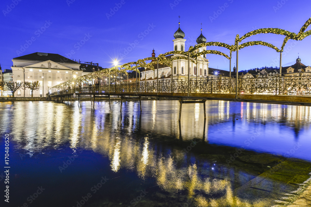 Liuzern with christmas lights reflected in the water Liuzern with christmas lights reflected in the water