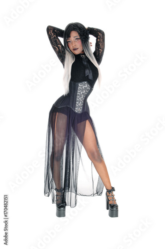 Beautiful woman in corset and hand behind her head