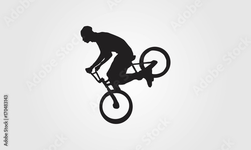 Cyclist rider bmx performs trick jump logo silhouette vector