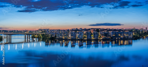 En sommarnatt med fantastiskt ljus över Lilla Essingne och speglingar i Mälaren photo