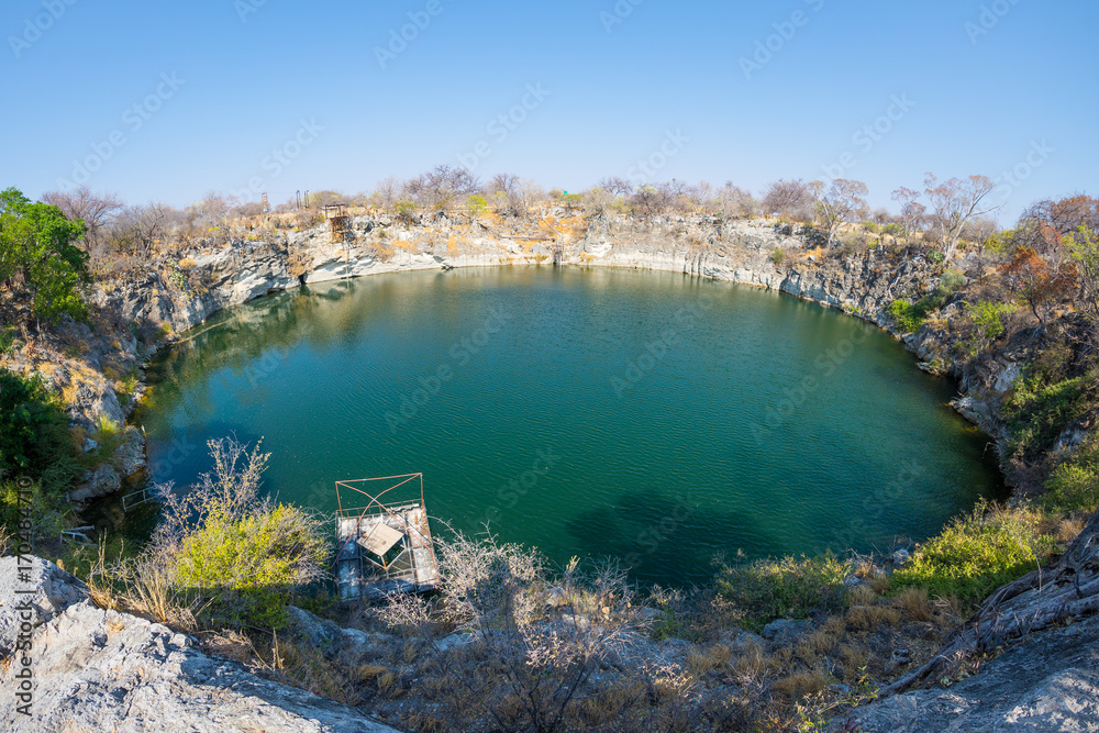 Otjikoto Lake, one of the only two permanent natural lake in Namibia, famous travel destination in Africa. Ultra wide view.