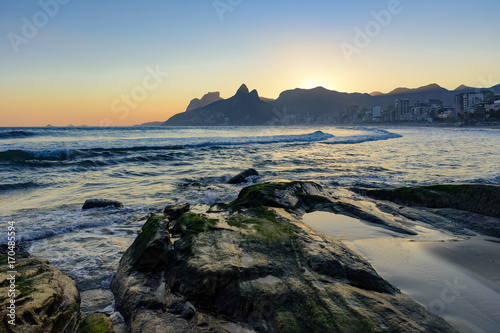 Summer sunset and stones at Ipanema beach in Rio de Janeiro