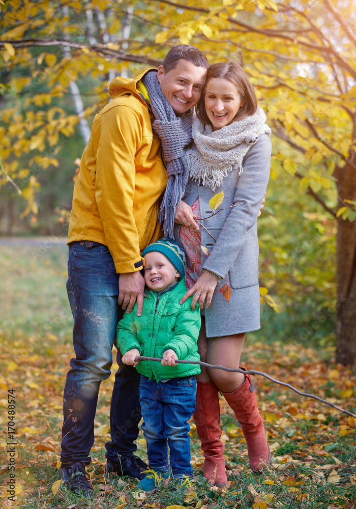 Happy family playing in autumn park