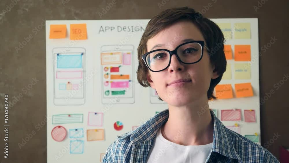 Portrait Young UX designer smiling in creative agency office