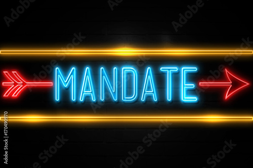 Fotografija Mandate  - fluorescent Neon Sign on brickwall Front view
