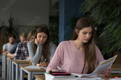 University students during exam in classroom photo