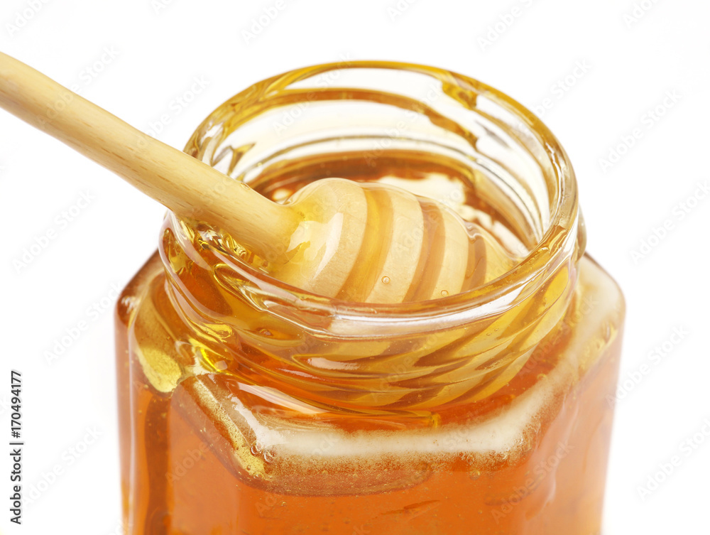 honey stick in a jar with honey honey stick in a jar with honey