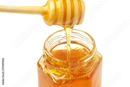 honey in a jar on a white background