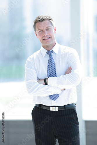 Image of serious business man which posing in studio © ASDF