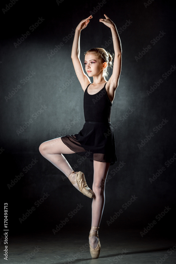 Young and incredibly beautiful ballerina posing and dancing in the studio. Ballet dancer.