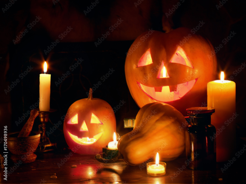 Halloween Jack O' Lantern pumpkin head stacked at Halloween night with burning candles on black background. Halloween Jack O' Lantern pumpkin head stacked at Halloween night with burning candles on black background.