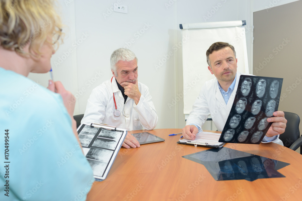 doctors looking at x-ray doctors looking at x-ray
